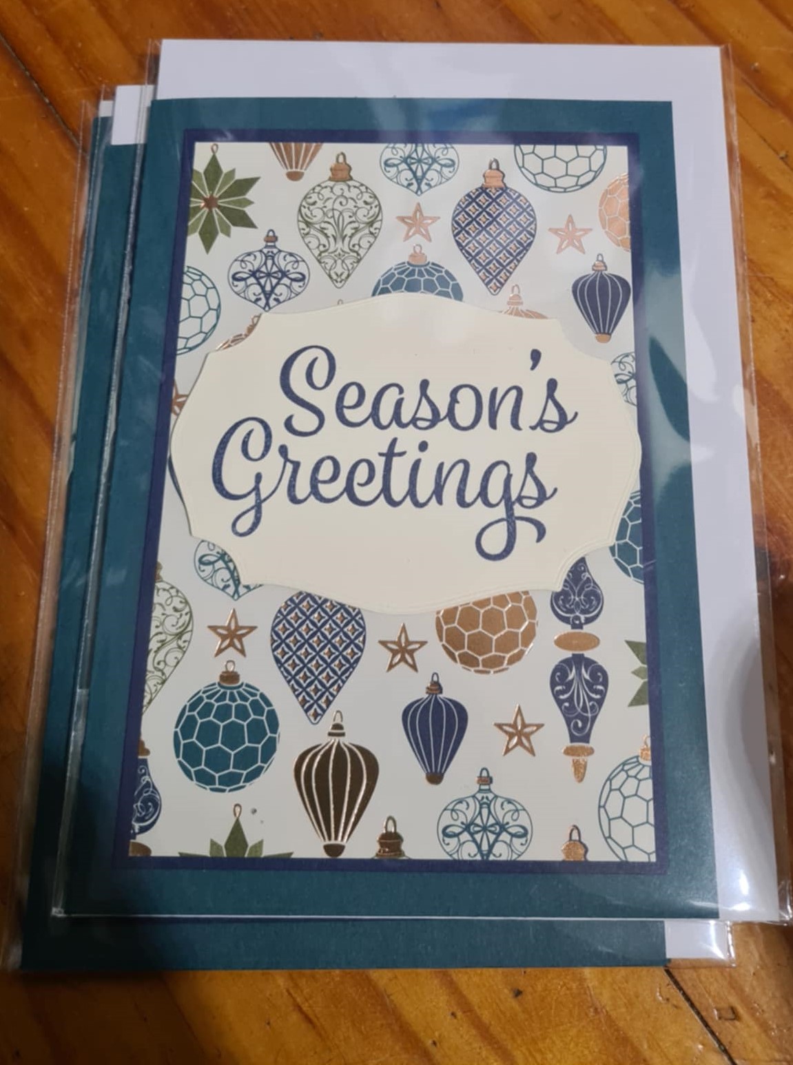 Seasons greetings baubles card
