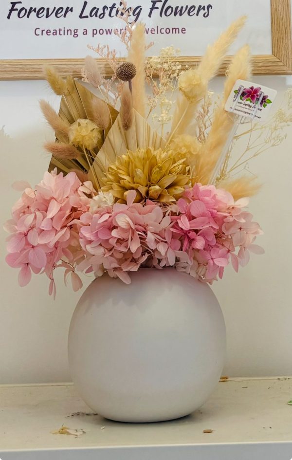 Dried flowers in large bubble vase