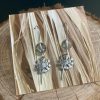 Hand-made Dandy earrings, hanging from hand-formed Argentium Silver hooks, with gemstones. Displayed on The Raffia Kat gift card