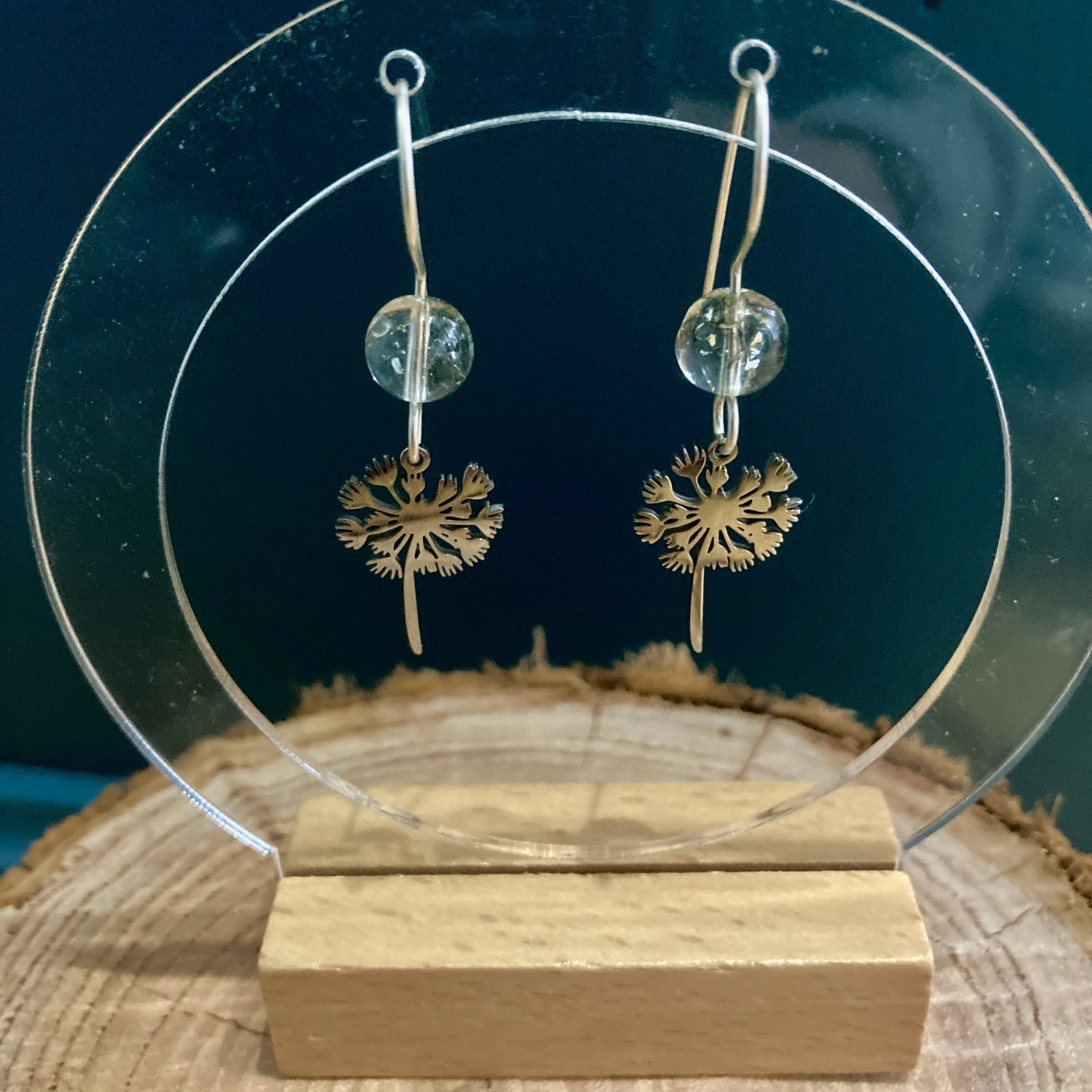 Hand-made Dandy earrings, hanging from hand-formed Argentium Silver hooks, with gemstones. Displayed on The Raffia Kat gift card