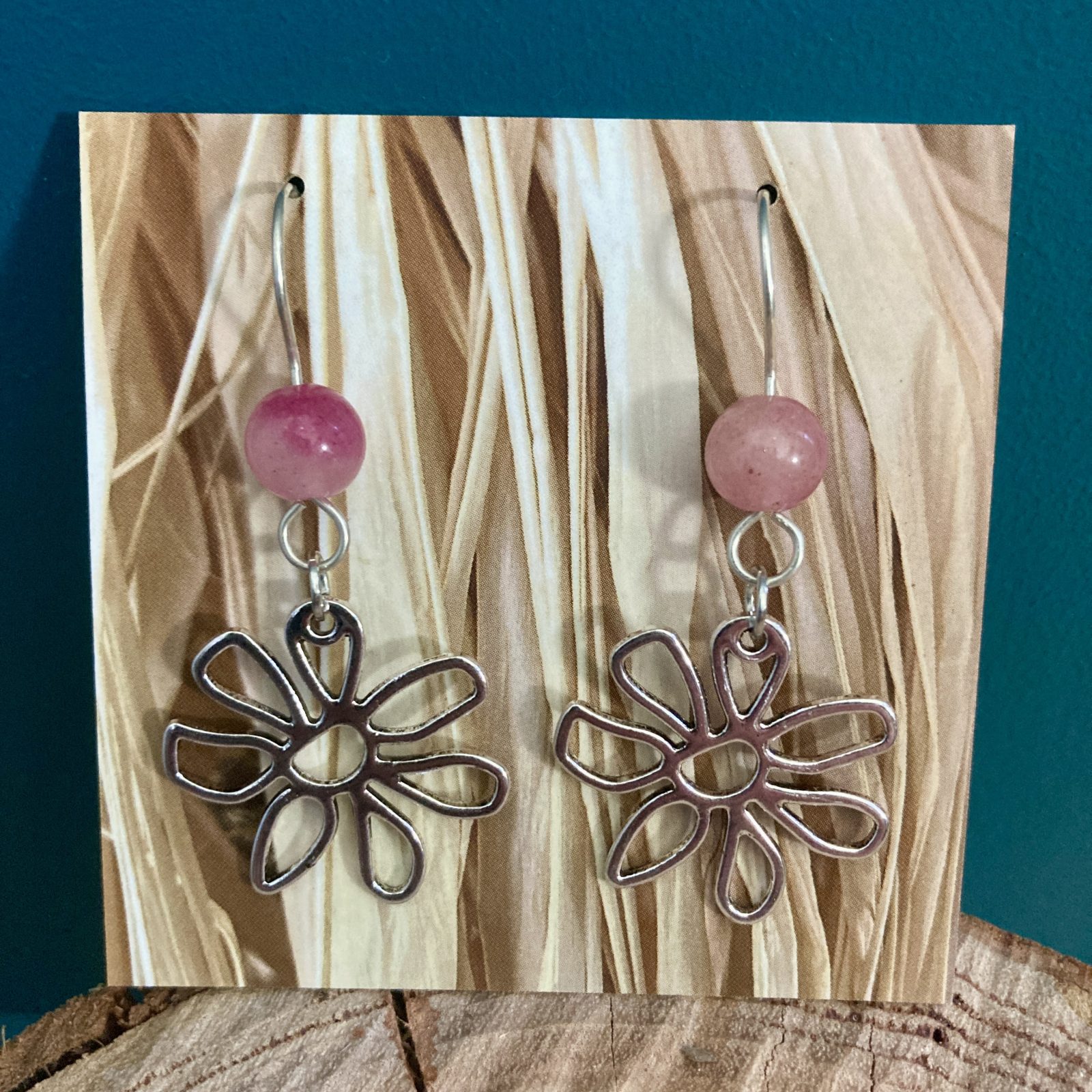 Hollow Flower earrings with pink gemstones