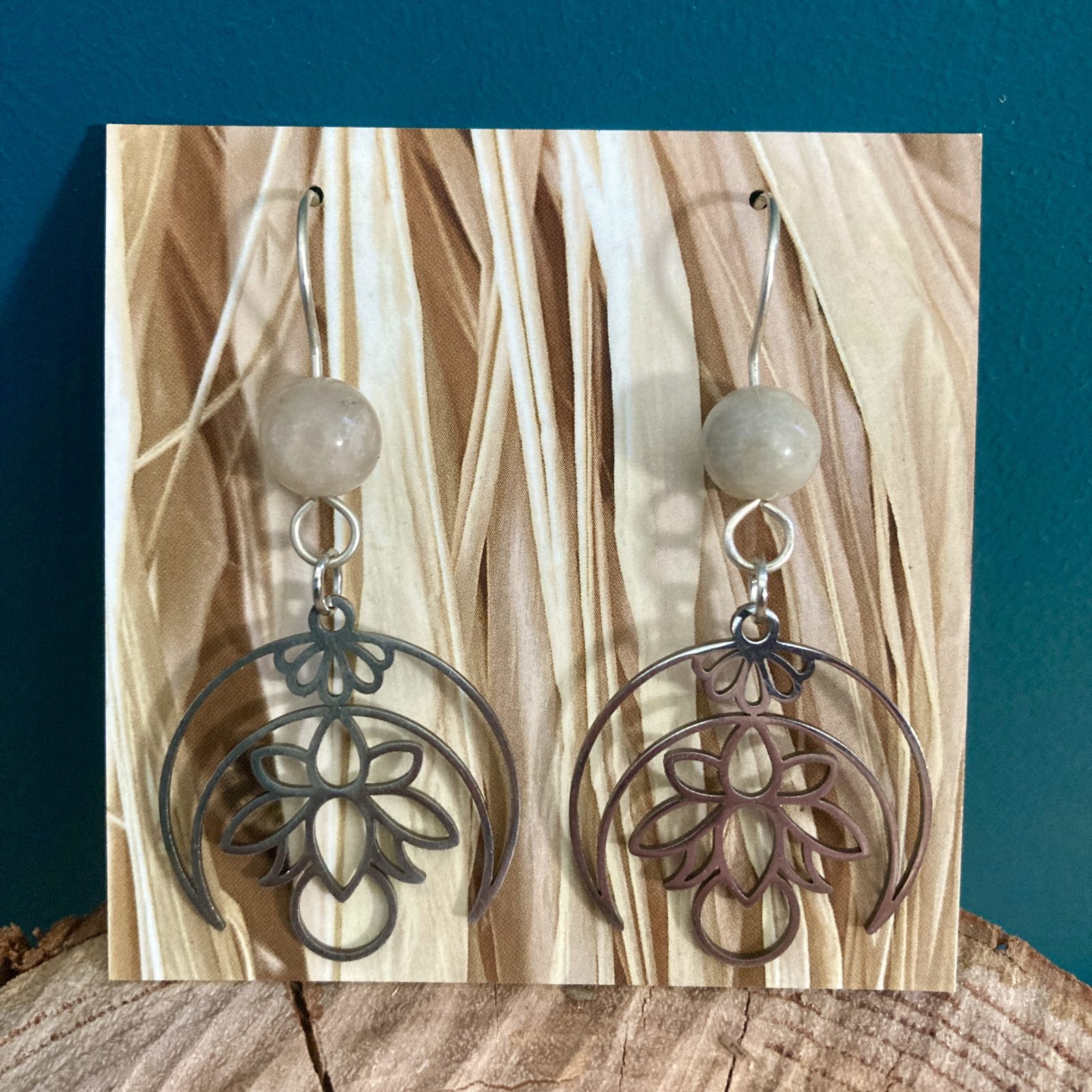 Crescent Moon and Lotus earrings with white gemstones