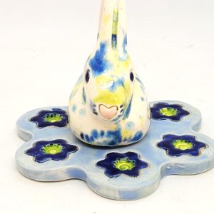 Blue Bunny on a flower bed