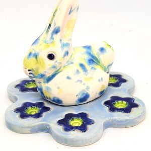 Blue Bunny on a flower bed